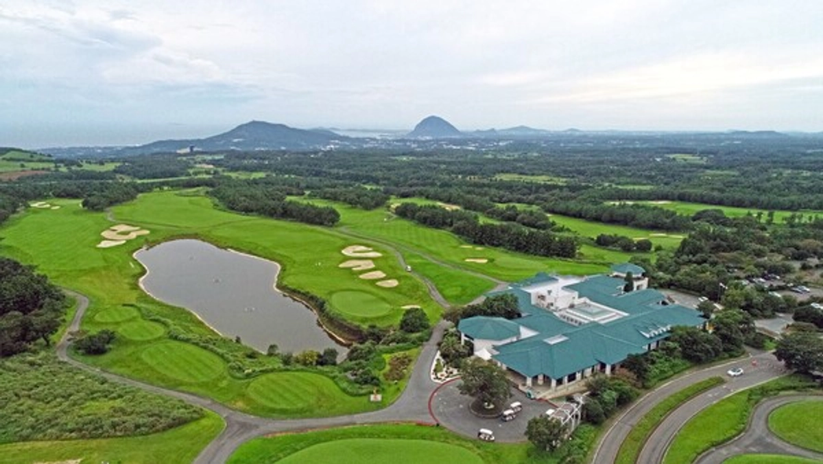 Lotte Skyhill Country Club Jeju course and clubhouse with southwest Jeju landscape